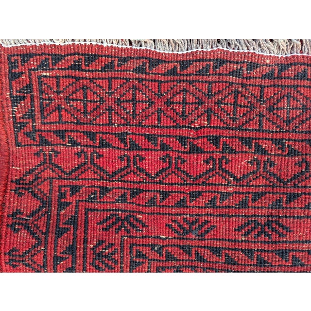 Large traditional Afghan rug with classic "Göl" motifs in the center, woven by Turkmen ethnic groups in northern...