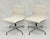A sophisticated pair of Eames Aluminum Group swivel chairs, the celebrated mid-century modern seating design by Charles...