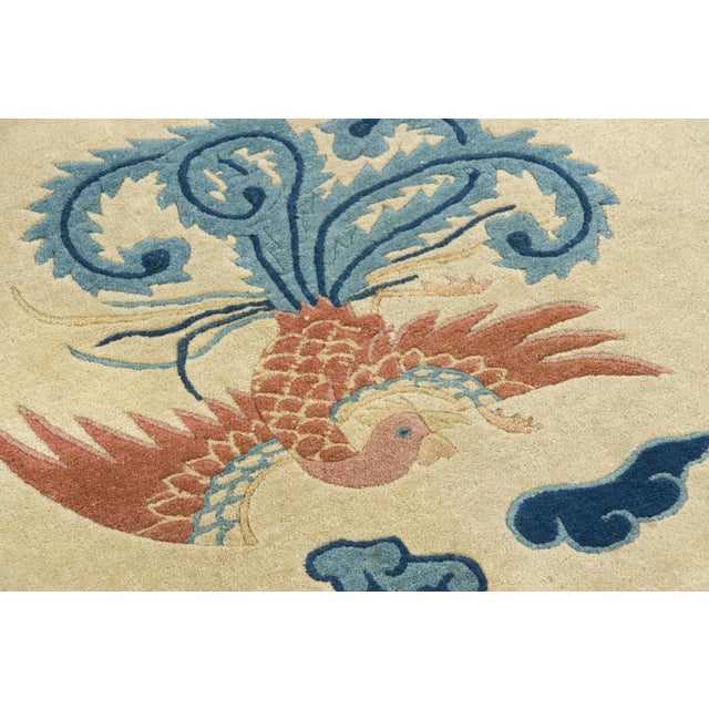 Hand-knotted in wool, this 2x2 antique Chinese Peking circular rug originating circa 1920-1929 is an exciting addition to...