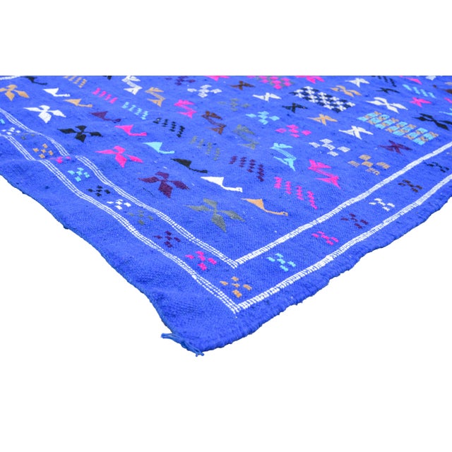 Berber kilim handwoven of cactus silk and wool by the Berbers of Morocco's Atlas Mountains. Features diamond motifs and...