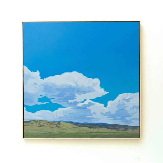 This oil on linen painting captures a serene landscape under expansive blue skies, dotted with soft, billowy clouds. The...