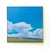 This oil on linen painting captures a serene landscape under expansive blue skies, dotted with soft, billowy clouds. The...
