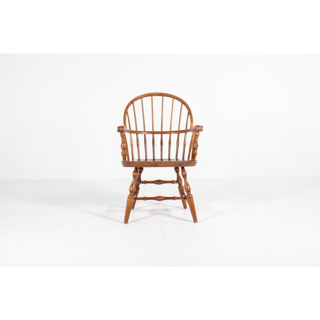 A beautiful and classic Windsor armchair made from solid wood, most likely elm and beech — the traditional combination...