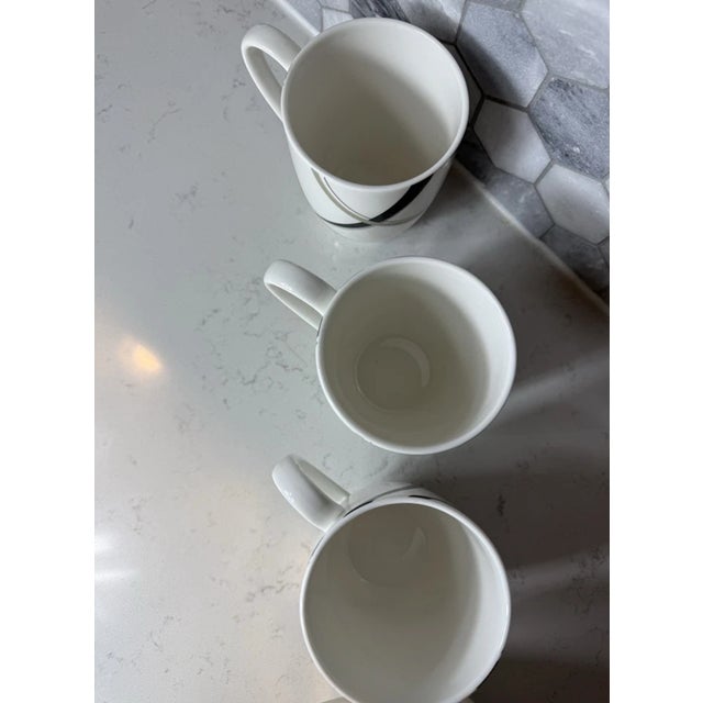 Stylish Set of 6 Lenox Vibe Coffee Mugs featuring a modern gray and black swirl pattern. These mugs showcase Lenox’s...