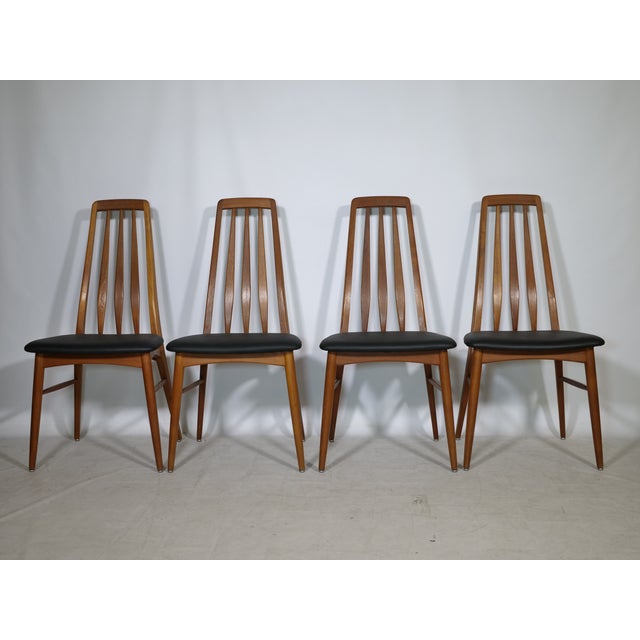 Four dining chairs, model "Eva" by Niels Koefoed for Hornslet, from the 1960s. Made of teak with black leather upholstery...
