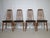 Four dining chairs, model "Eva" by Niels Koefoed for Hornslet, from the 1960s. Made of teak with black leather upholstery...