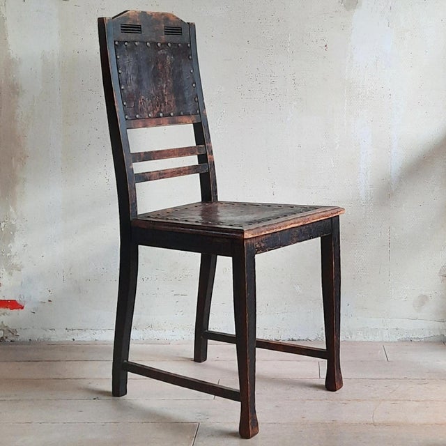 This beautifully patinated Art Nouveau chair still has the original leather upholstery on backrest and seat, attached with...