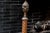 Magnificent 19th-century wrought-iron andirons featuring proud griffins at the base and elegant torch-shaped finials...