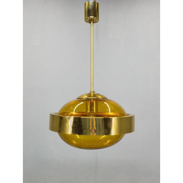 Space Age pendant lamp produced in Czechoslovakia during the 1970s by the renowned glassmaking center Kamenický Šenov. The...