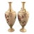 A fine and highly decorative pair of Royal Worcester blush ivory porcelain vases dating to 1900. The vases combine elegant...