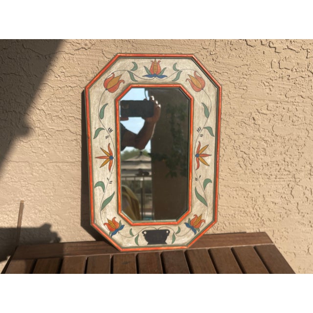 This stunning piece is an authentic 1930's Spanish hand-painted accent mirror, showcasing a timeless folk art style. The...