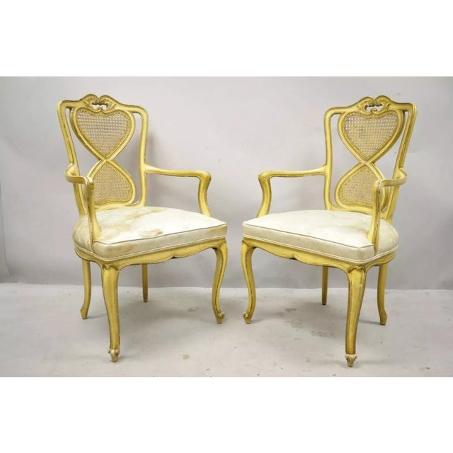 Vintage Italian Provincial French Louis XV Style Yellow Cane Dining Arm Chairs - a Pair. Item features cane backs, solid...