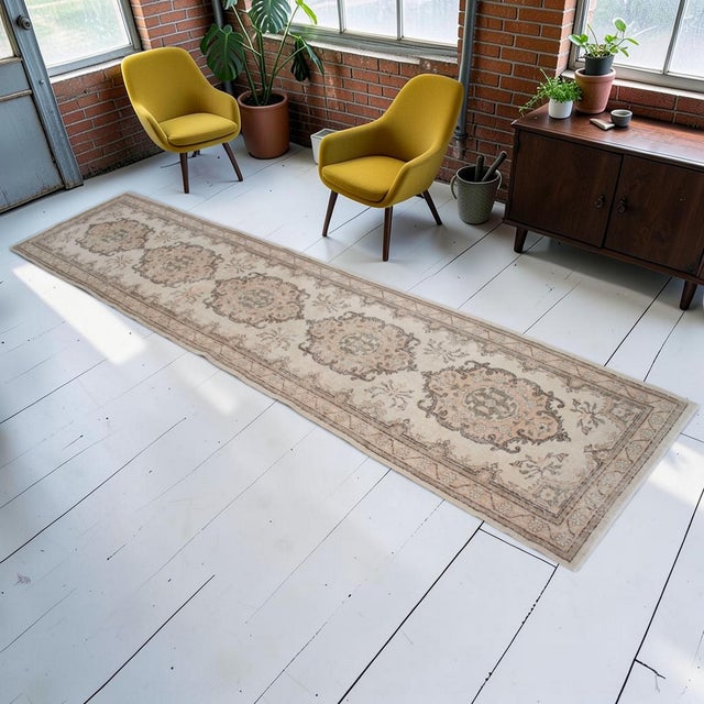This authentic 1970s hand-knotted runner rug originates from Central Anatolia, bringing a timeless sense of artistry to...