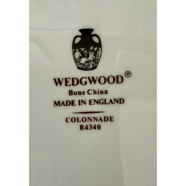 Expertly crafted in England, the Wedgewood Black "Colonnade" Bone China Dinner Service for 12 offers timeless elegance....