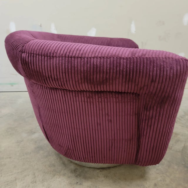 Great swivel/rocker with a fresh burgundy color wide whale corduroy. The material is so soft to touch. It is a good accent...