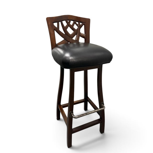 A set of bar stools from designer Martin Pierce. Hand-carved walnut with black full-grain leather seats and hand-hammered...