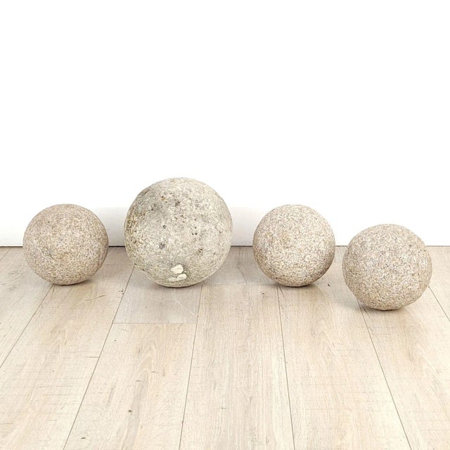 A group of four antique and vintage spheres, Italy. The largest measures 10.75" diameter; the three smaller spheres...