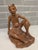 Overview An extraordinary, gallery-grade Mid-Century Balinese modernist portrait sculpture depicting a seated elder or...