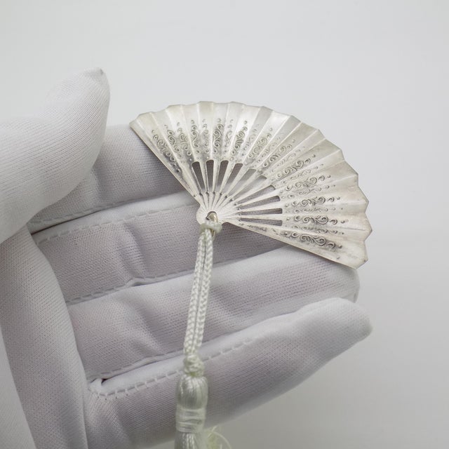 A vintage miniature / bookmark depicting a decorative fan, handcrafted in silver in italy between the 1970s and 1980s,...