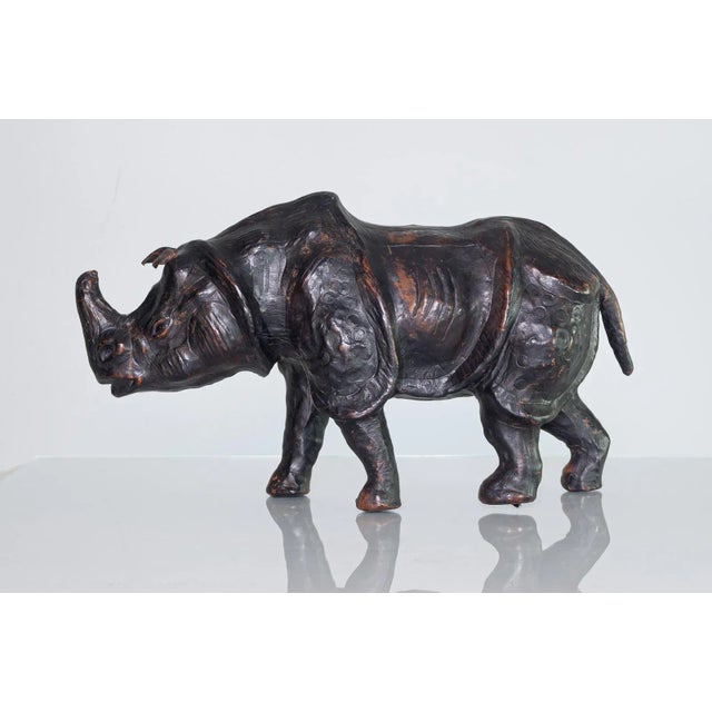 Vintage mid 20th century leather-wrapped rhinoceros sculpture 12 inches in length — perfect size for a tabletop or shelf...