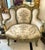 Bring romantic French elegance to your home with this charming petite settee, featuring beautiful ivory-beige upholstery...