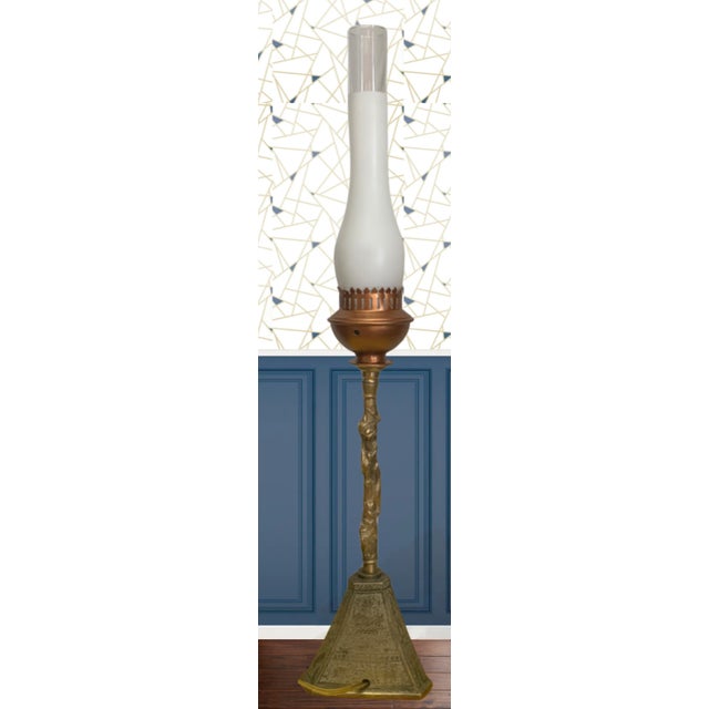 Illuminate your space with this extraordinary antique brass torchiere table lamp, a stunning fusion of artistry and...