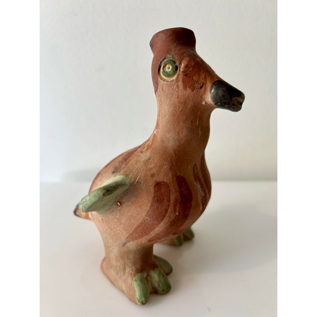 Adorable vintage Mexican clay duck candleholder. Hand painted with black, burnt sienna and green accents.