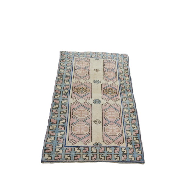 Hand-knotted with care using traditional rug making techniques, this wool rug blends timeless craftsmanship with a modern...