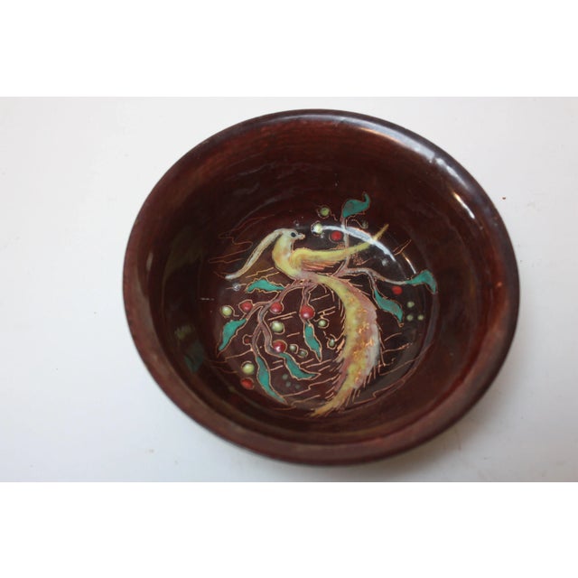 Small, enamel on copper bowl handmade in Holland circa 1950s. Yellow peacock decoration with hand-applied gold leaf detail...