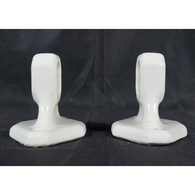 Vintage European white ceramic towel bar brackets with a crackle glazed finish. The bar has an octagon shape with smaller...