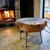 Rustic side table made of reclaimed live edge wood slab top and iron peg legs. The brutalist table top has an asymmetric...