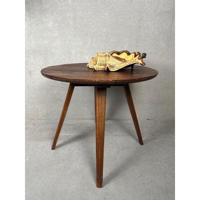 Round vintage oak side table. Conical slender legs. Diameter: 63cm. Height: 55cm. Weight: 8kg. Fits perfectly in a ‘wabi’...