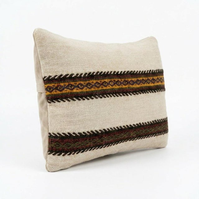 This beautiful 16'' X 24'' pillow cover was made from an authentic Turkish Kilim. Bright colors of wool adorn the front of...