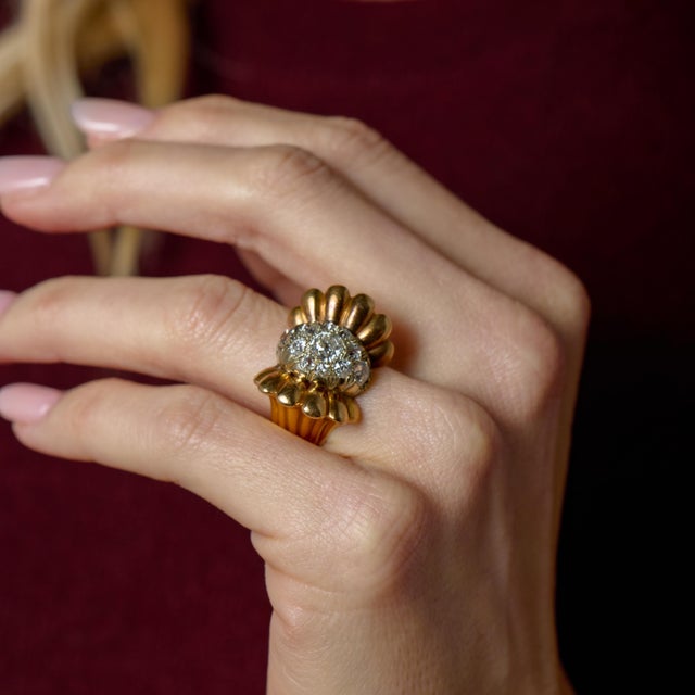 This striking Retro-era ring captures the bold sophistication of 1940s design, showcasing a captivating arrangement of old...