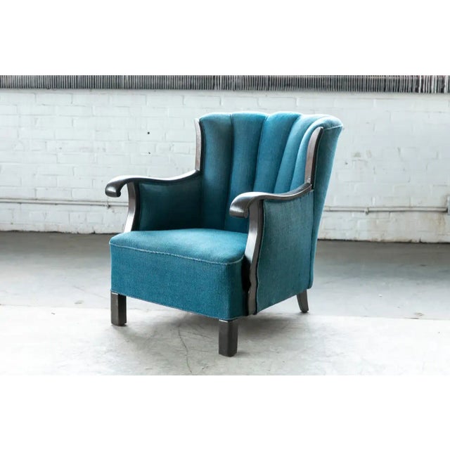 Beautiful Classic 1930s-1940s solid mahogany and wool wingback chair in the style of Master Cabinetmaker Frits Henningsen,...