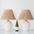 A pair of 1970s spanish ceramic table lamps crisply glazed in white and modeled in a convincing faux-wicker pattern; the...