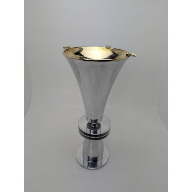 Unusual standing ashtray in the shape of a goblet, probably from the 1940s, manufacturer unknown. The brass top can be...