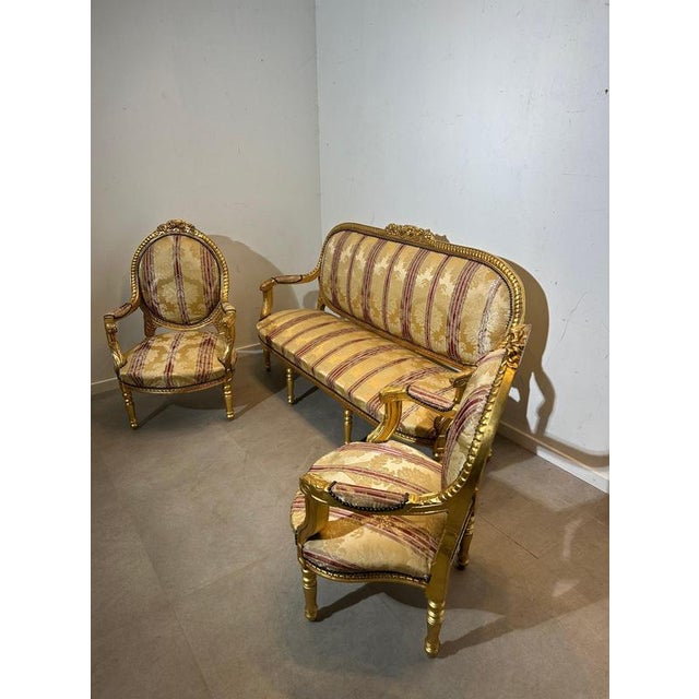 Bring timeless French elegance into your interior with this stunning Louis XVI–style salon ensemble. The set includes a...