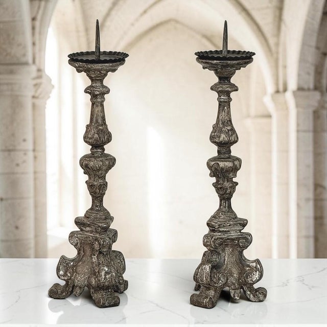 Created for an Italian church during the Baroque period, this exceptional pair of 18th century antique candlesticks...