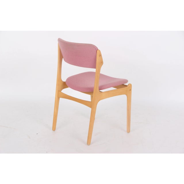 Five dining chairs, model 49, without armrests. Light, solid beechwood, upholstered in pink wool fabric by the Danish...