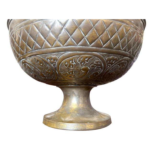 This decorative bowl is the perfection addition to any tablescape. Its hammered brass finish offers a beautiful handmade...
