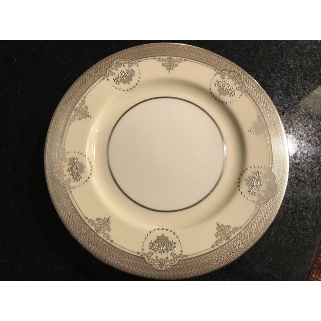 A set of elegant sterling silver overlay service plates with the pre-1930 Lenox green mark. This opulent set is early 20th...
