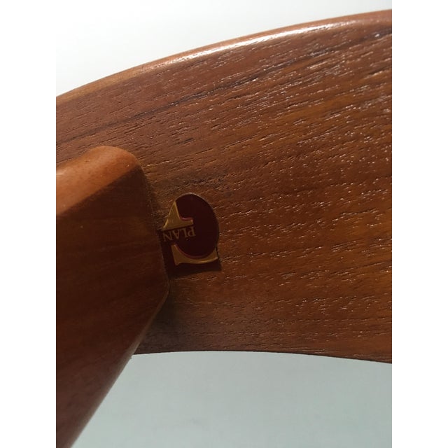 This round coffee table is made of solid teak and comes with a glass top. It was designed in the 1960s with a Danish...