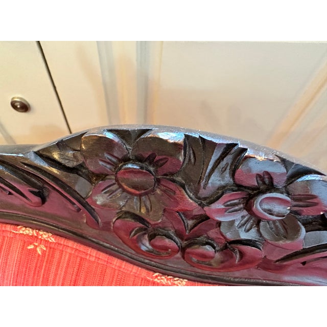 Pair of like new custom upholstered Bergere Chairs and bolster pillows. Beautiful deep apricot color designer fabric with...