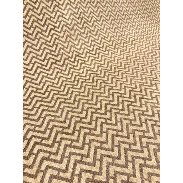 This modern fabric is taupe and tan with a chevron design. Its hand is soft, and it is multipurpose. This fabric is a...