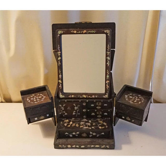 From a wealthy high ranking Chinese family, this Qing Dynasty item made from dark hard wood with elaborate Mother of Pearl...