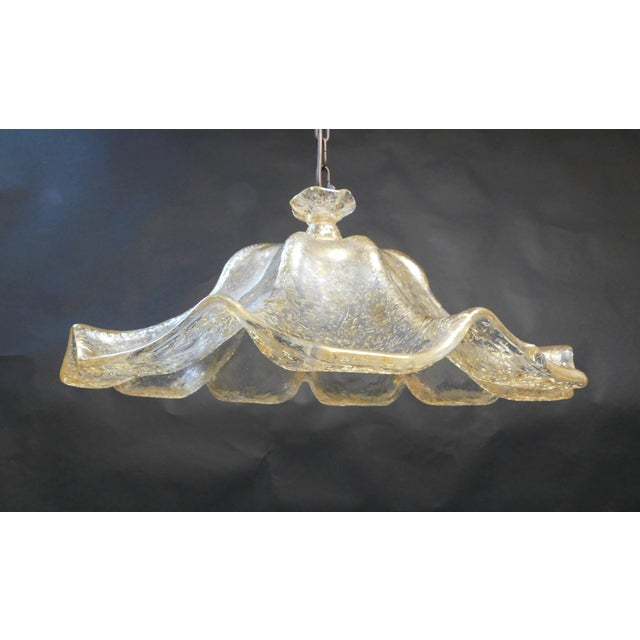 Vintage Italian Murano glass pendant, hand blown in the form of a flower, in golden amber color with granular texture /...
