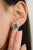 These modern statement stud earrings feature a vibrant cushion-cut emerald, beautifully framed by sparkling diamonds. The...