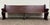 This is a gorgeous antique American Gothic Revival church pew dating to approximately 1890–1920. Crafted from solid oak,...