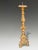 A highly decorative 18th-century Italian Baroque ecclesiastical candle stand, finely carved in limewood and finished with...